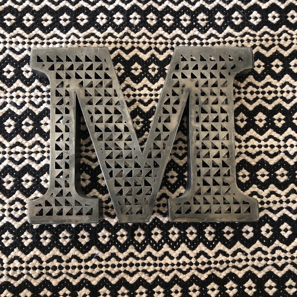Distressed metal initial ‘M’